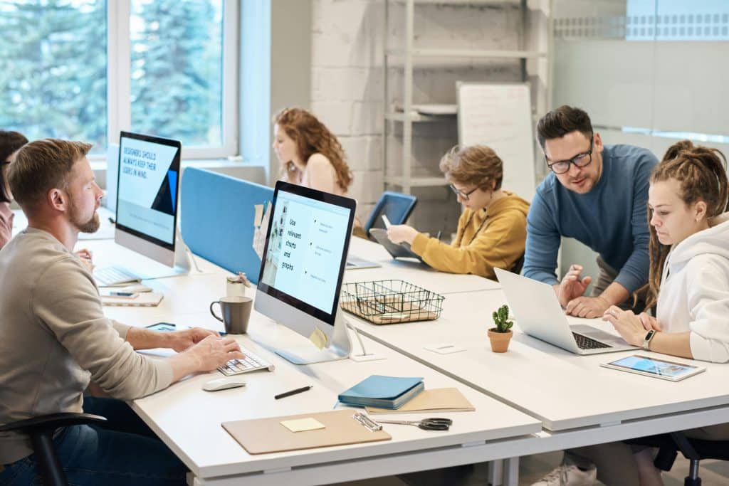 A group of people on computers